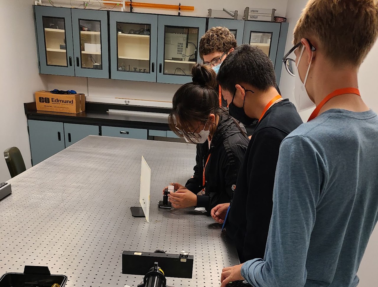 Working with professional equipment in a UCSD photonics laboratory